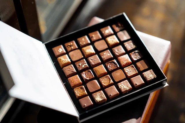 An open box of chocolate truffles