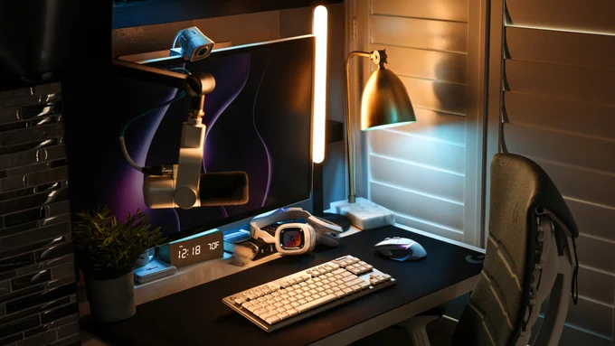 A gaming setup equipped with a Logitech G G502 X Plus and G915 TKL in white alongside a Logitech G ASTRO Gaming A30, Blue Sona and LITRA Beam. The full desk setup is visible as if someone is ready to use it.