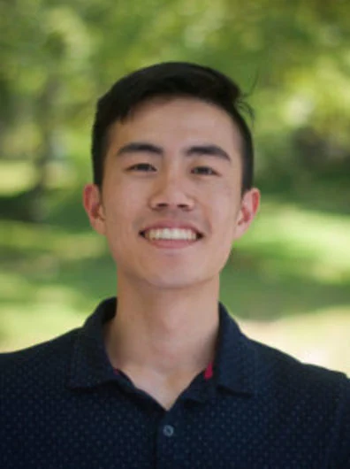 headshot of a man smiling