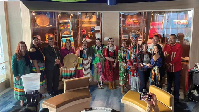 A group photo inside the Indigenous Interpretive and Retail Centre.