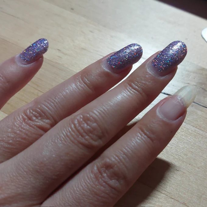 Manicure with one nail completely unpolished 