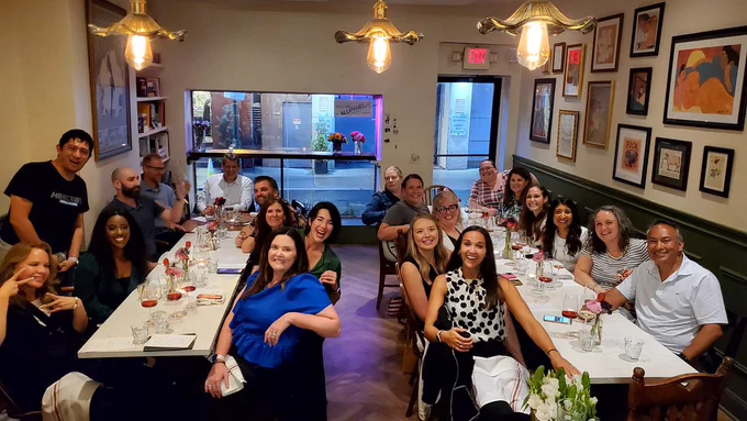 Minecraft Education ambassadors gathering for dinner during the ISTELive 2023 conference. 