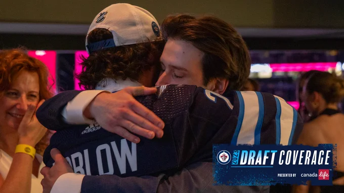 Colby Barlow and his family embrace at round one of the 2023 Upper Deck NHL Draft at Bridgestone Arena on June 28, 2023 in Nashville, Tennessee.