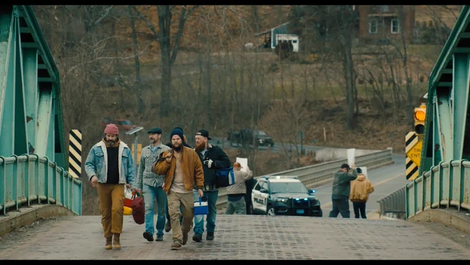 Veterans cross a rural bridge in a scene from Sheepdog, a film exploring post-traumatic growth, reintegration and the unseen battles many service members face after returning home. (Credit: Team House)