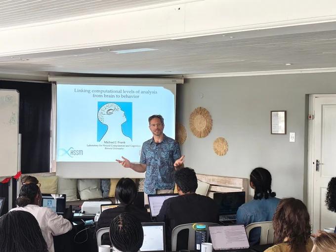 Prof Michael Frank is talking about linking computational levels of analysis from brain to behavior.