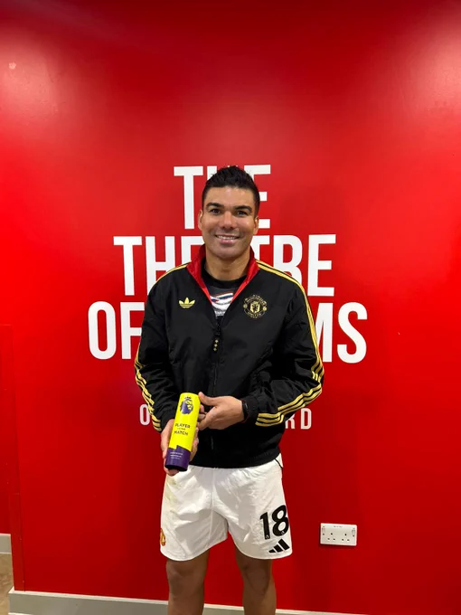 Casemiro poses with his Premier League Player of the Match award.