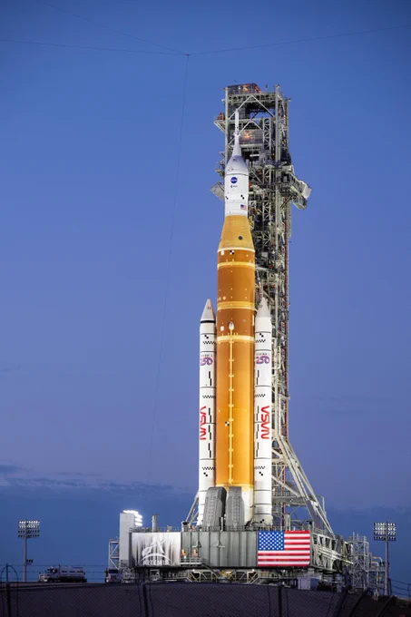 NASA’s Artemis II Space Launch System (SLS) rocket and Orion spacecraft are seen illuminated by lights at Launch Complex 39B. Credit: NASA/Keegan Barber