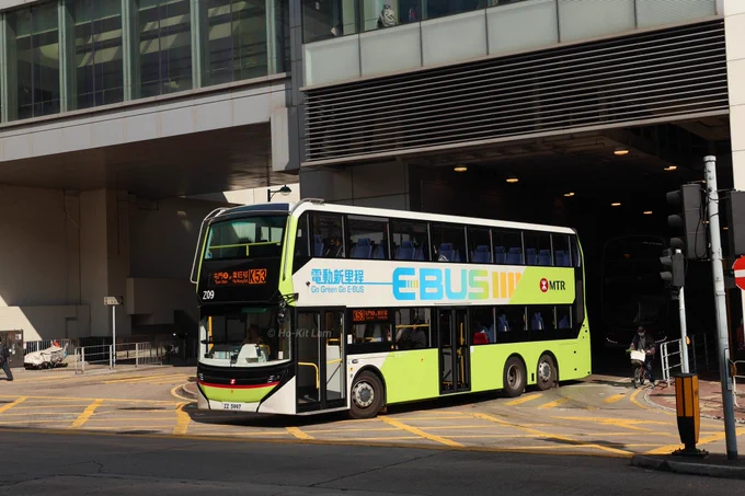MTR Z09 (ZZ 5997) is a white and light green Alexander Dennis Enviro500EV and is pictured exiting Tuen Mun Station as it operates circular extension route K53 to and from Yip Wong Estate. 