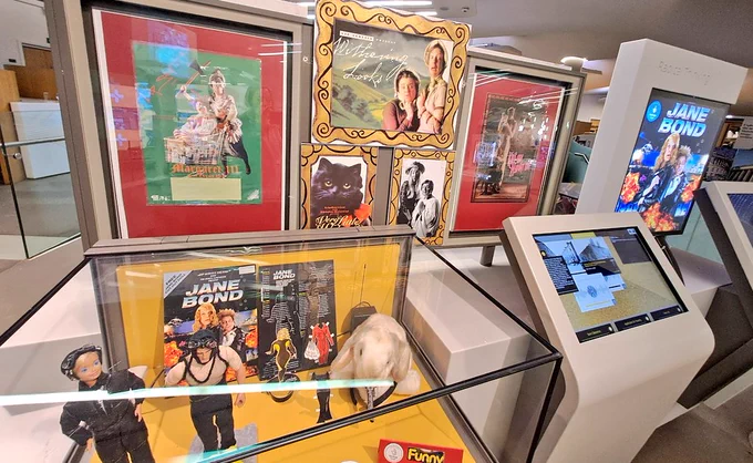 Props in glass cabinet plus posters on display 
