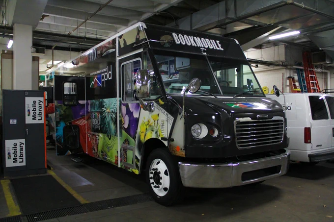 The new bookmobile is covered in images of past PPLD library cards.