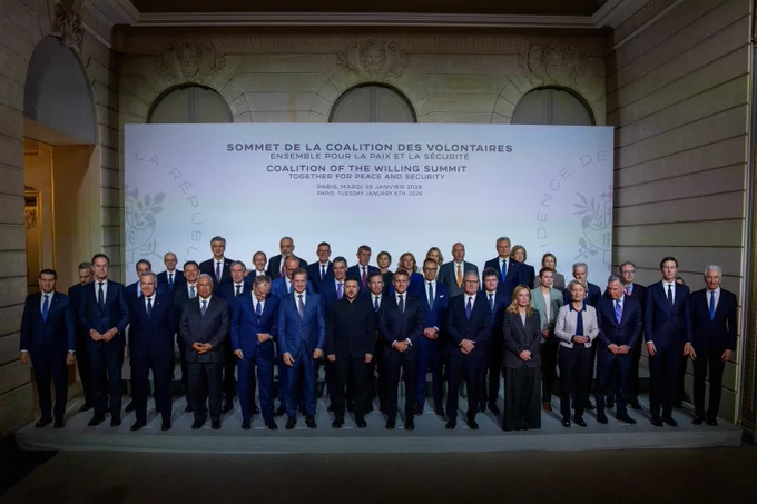 Prime Minister Mark Carney, President of Ukraine, Volodymyr Zelenskyy, alongside other members of the Coalition of the Willing pose for a photo.