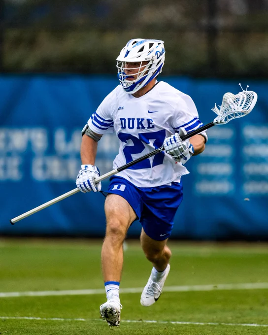 Duke men's lacrosse student-athlete Charlie Johnson in action with his lacrosse stick during match at Freeman Field at Koskinen Stadium. 