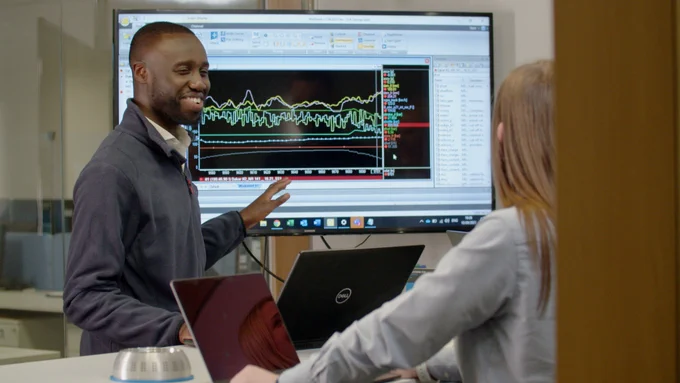 Mechanical engineer reviewing data on a screen.