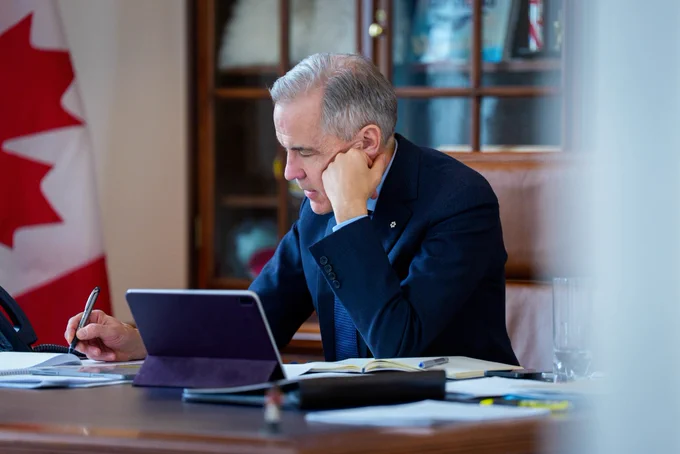 Photo of Prime Minister Carney in his office in Ottawa, Ontario, calling German Chancellor Merz.