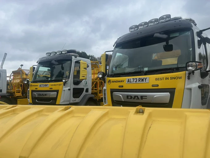 Two gritters with snow ploughs