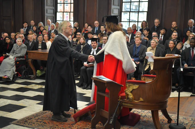 Christopher Evans receiving his award from Professor Deborah Prentice
