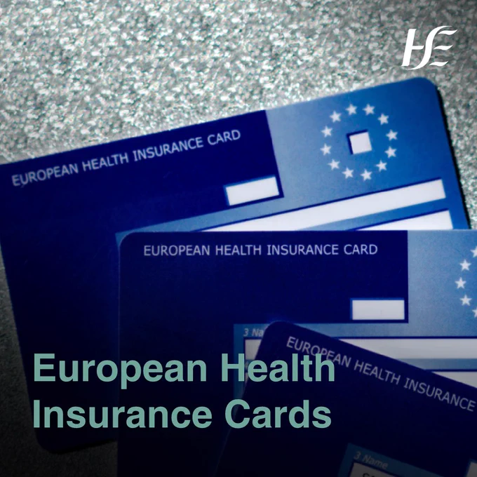 Three European Health Insurance Cards on a table. 