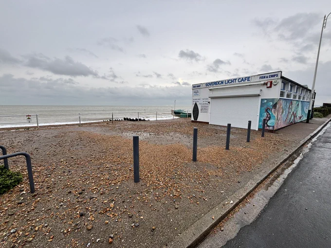 Shingle covers the promenade in Bexhill-on-Sea.