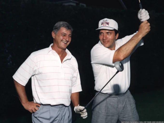 Carl Yastrzemski, left, and Johnny Bench in golf attire during Hall of Fame Weekend 1989. (National Baseball Hall of Fame and Museum)
