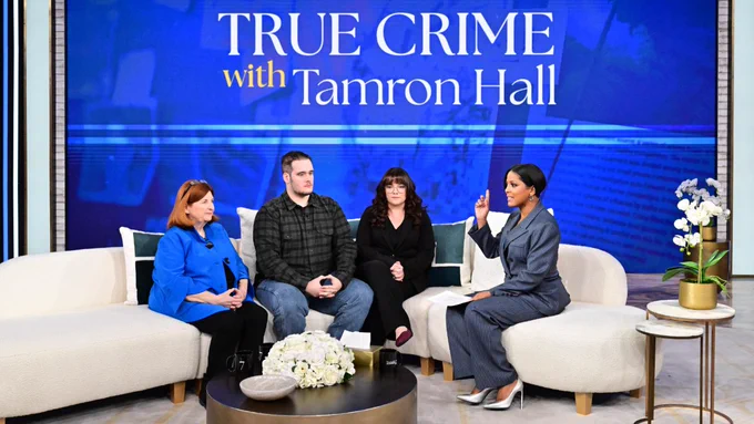 A group of people sitting around a table with a screen reading, "True Crime with Tamron Hall."
