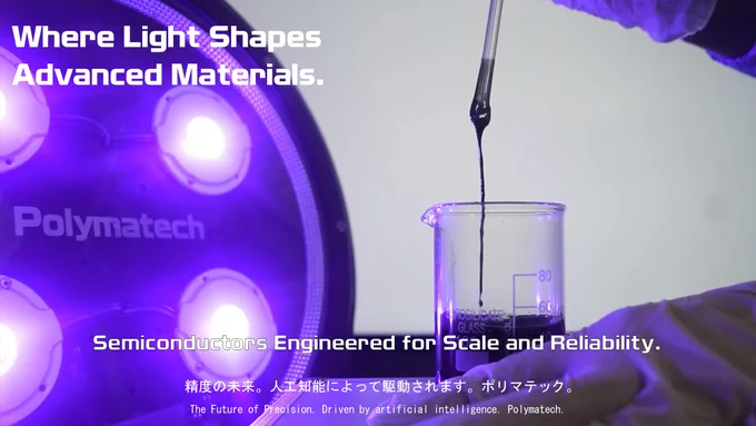 A laboratory UV curing setup featuring Polymatech’s LED-based ultraviolet light, illuminating a beaker of dark liquid material as it flows from a pipette under controlled conditions, demonstrating precision photonic processing for advanced materials and semiconductor applications.