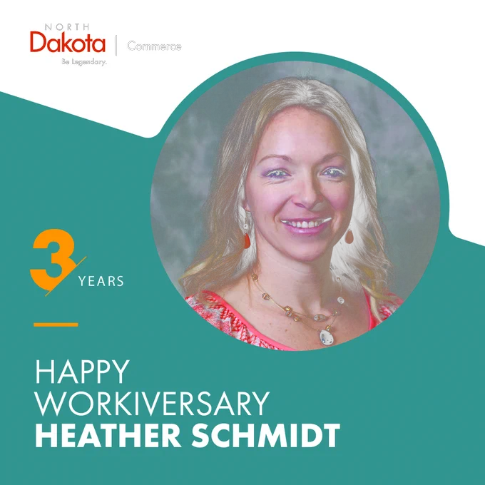 A commemorative graphic celebrating Heather Schmidt's three-year work anniversary with the North Dakota Department of Commerce. It features her portrait in a circular frame against a teal and white background with the text "3 YEARS HAPPY WORKIVERSARY HEATHER SCHMIDT" and the North Dakota Commerce "B