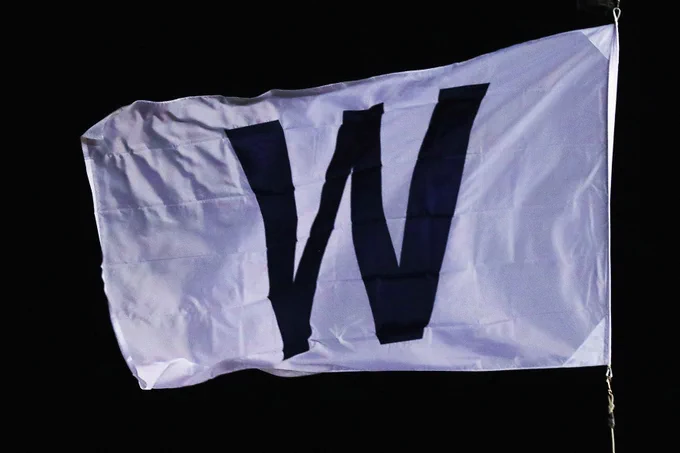 An image of the "W" flag flying above Wrigley Field after a Cubs win.