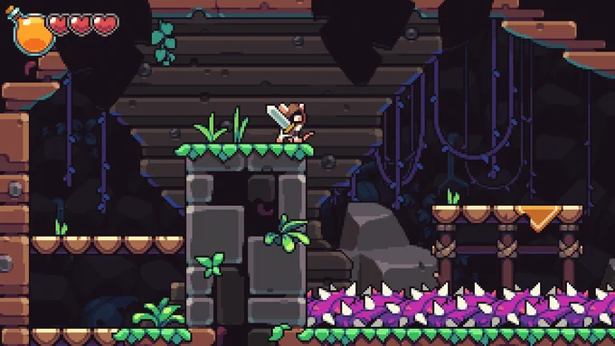 A scene from my pixel art game Pipsqueak!, after the scene has art added to it. The scene depicts our hero Tofu, a small mouse with a big sword, standing near a ledge overlooking a pit of spiky vines. The environment is made up of dirt, stone, and wooden platforms, and is very lush with overgrowth everywhere.