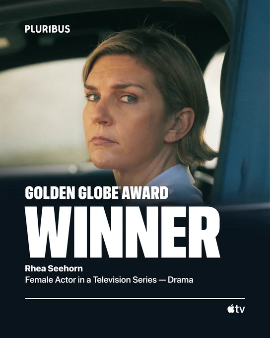 From Pluribus. Carol Sturka portrayed by Rhea Seehorn is seen in a closeup. At the top left of the image is the Pluribus title treatment. On the lower left of the image, “Golden Globe Award Winner Rhea Seehorn Female Actor in a Television Series — Drama” is written. Below that, on the bottom right of the image is the Apple TV logo.