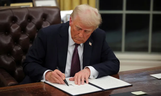President Trump speaks during a public address, warning Cuba to make a deal before it is too late, with a serious expression and official backdrop.