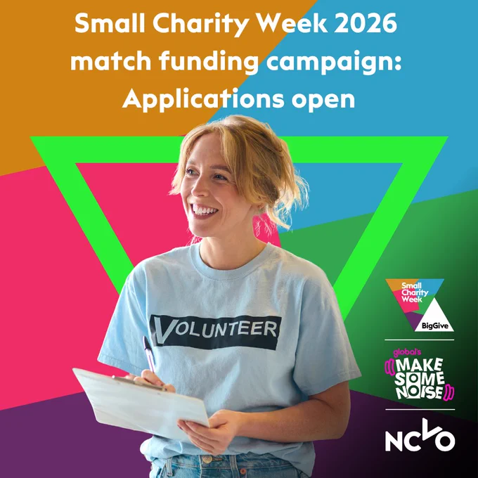 Smiling volunteer holding a clipboard, wearing a “Volunteer” T-shirt, set against a colourful geometric background. Text reads: “Small Charity Week 2026 match funding campaign: Applications open,” with Small Charity Week, Big Give, Global’s Make Some Noise, and NCVO logos.
