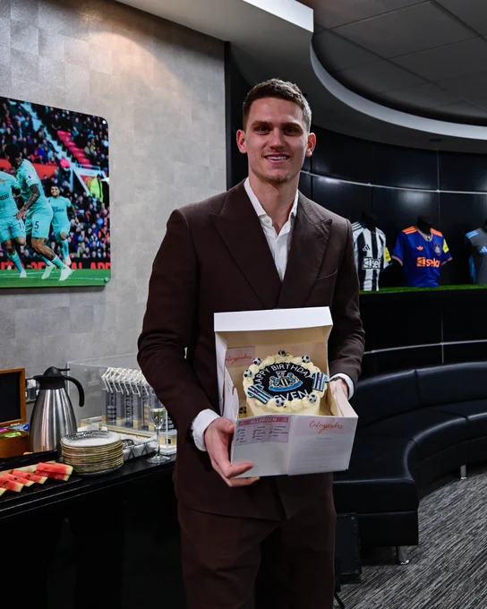 Sven Botman pictured holding a birthday cake. 