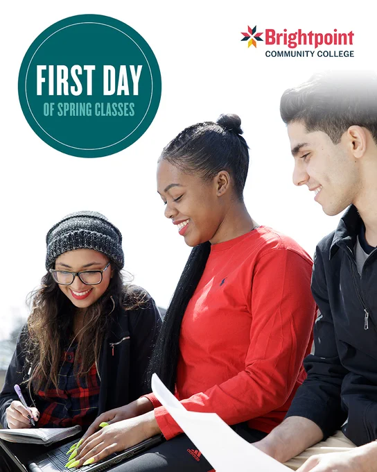 Three students smile while looking at their laptops and class schedules. "First day of spring classes" appears in bold text above.