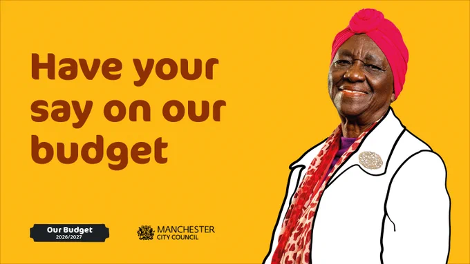 Bright orange background with bold maroon text reading “Have your say on our budget.” At the bottom left, a black label with white text says “Our Budget 2026/2027,” next to the Manchester City Council logo featuring a crest and the council name. On the right side, a person is shown wearing a white outlined coat with a decorative brooch and a patterned red scarf, along with a bright headwrap.