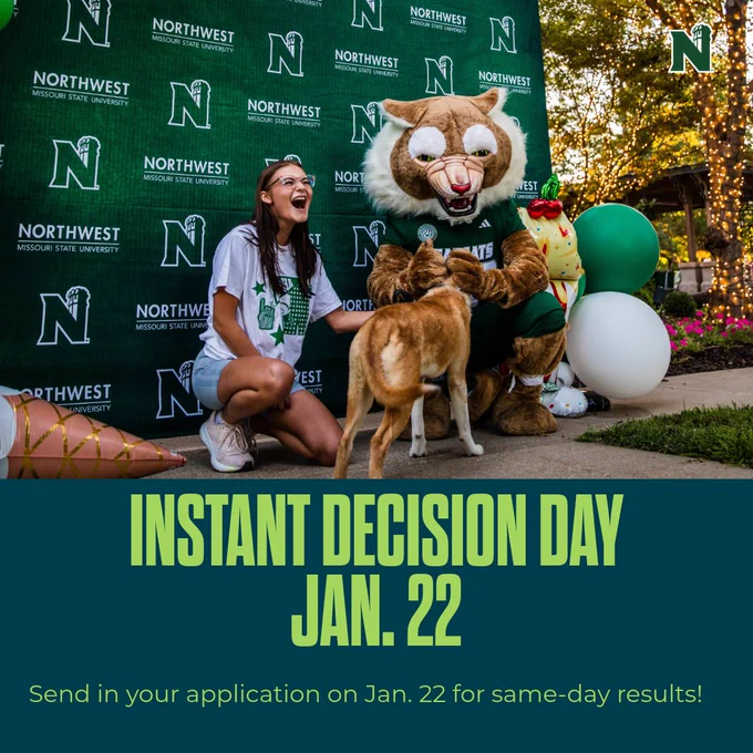 A student poses for a photo with Bobby Bearcat, and a dog with balloons and a Northwest photo backdrop.