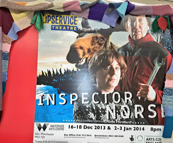 Scarf wrapped poster with heads of 2 women and a moose