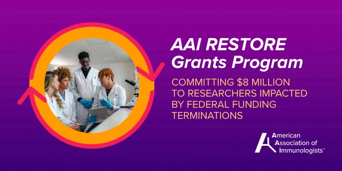Three scientists in lab coats discussing research data in a laboratory setting for the AAI Restore Grants Program.