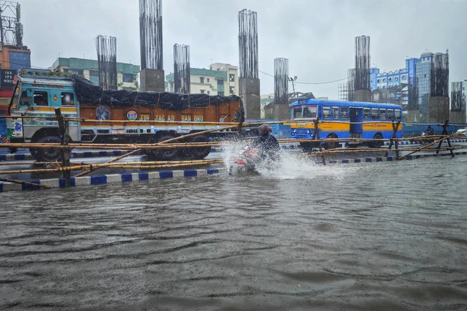 Street in City during Flood, Dibakar Roy, 2024 via Pexels https://www.pexels.com/photo/truck-and-bus-on-street-in-city-during-flood-26202109/