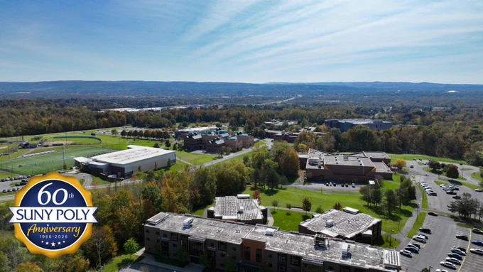 Aerial view of SUNY Polytechnic Institute’s Utica campus surrounded by trees, athletic fields, and academic buildings, featuring a 60th anniversary logo.