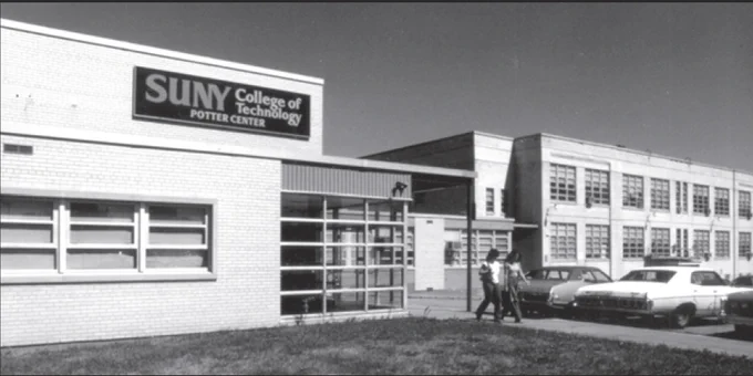 Black-and-white photo of the SUNY College of Technology Potter Center, with students walking near the entrance and vintage cars parked nearby.