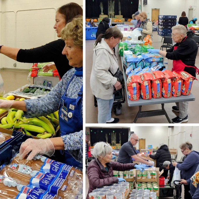 Volunteers distribute food at a community food bank, handling items like bread, bananas, and canned goods.
