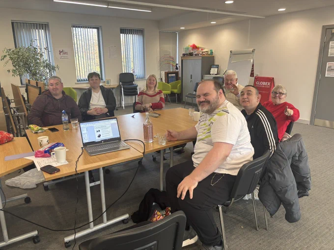 Group photo of TILII  round the table