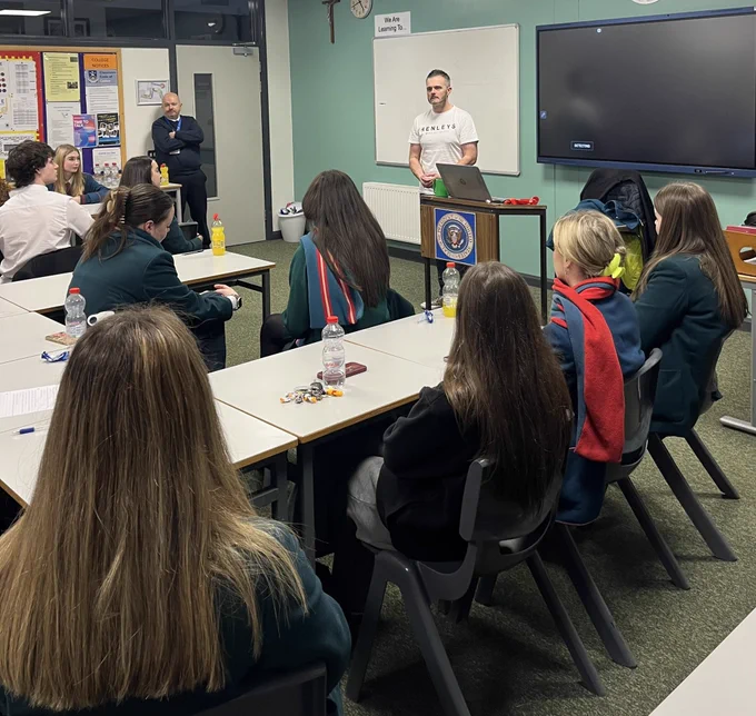 Robbie speaking to students at politics in action event