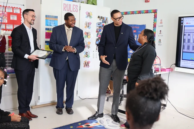 Chancellor Ferebee informs Ms. Marbury that she has been selected as the Ed Fund's Outstanding Educator of the Year.