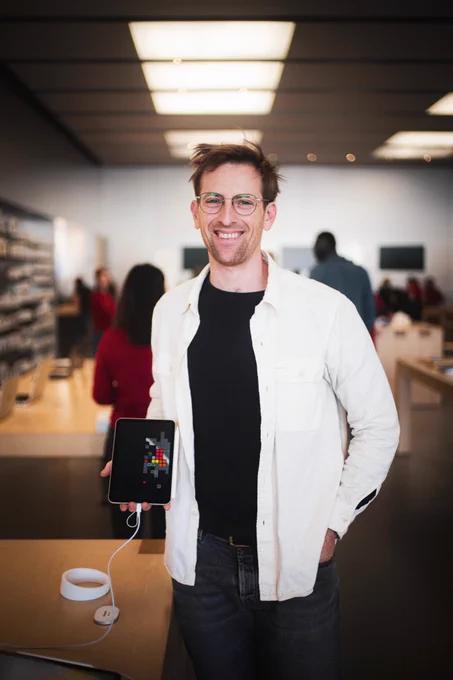 Ryan standing in apple store holding iPad running blackbox