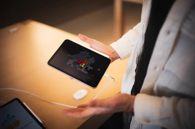Ryan in apple store holding iPad running blackbox