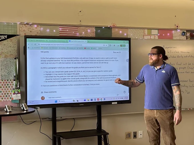 Mr. Wilkins works at the new interactive panel.