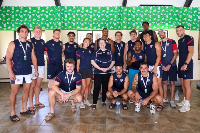 Ambassador Damour poses for a group photo with the team.