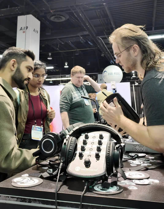 Hear Tech booth at NAMM Show displaying pro audio tools where the booth staff chat with trade show attendees.