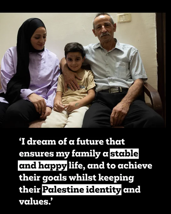 ‘I dream of a future that ensures my family a stable and happy life, and to achieve their goals whilst keeping their Palestine identity and values.’ 
Fidaa is sat on a sofa with her son and her father

